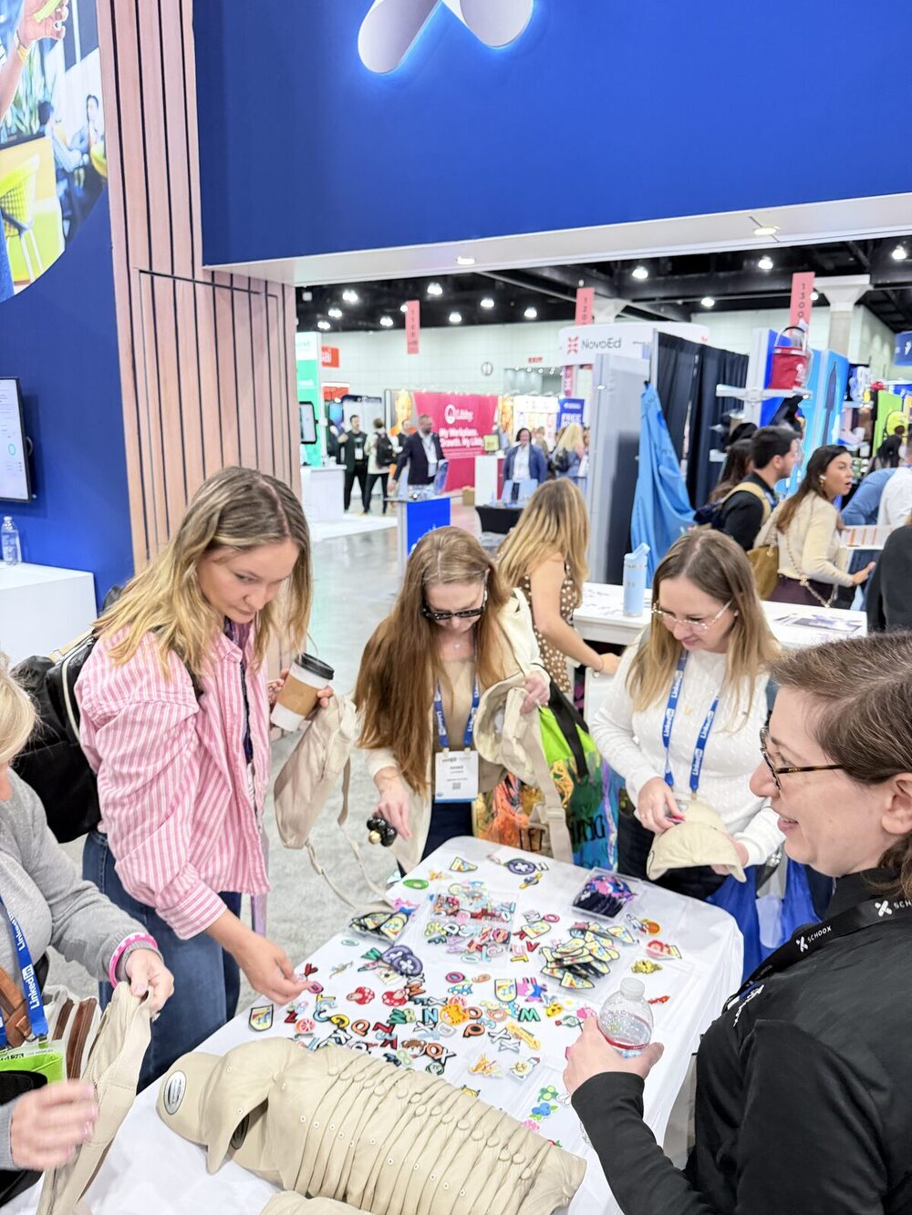 Guests choosing embroidered patches from a patch bar table at a live event